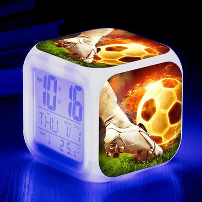 Colourful cartoon football pattern children's mute alarm clock on a table.