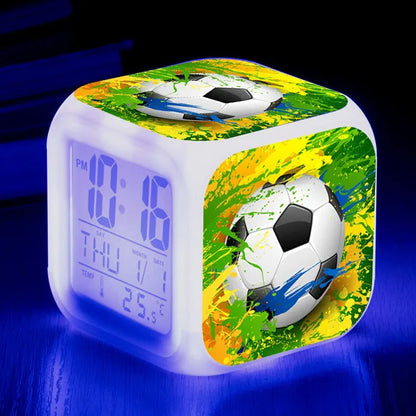 Colourful cartoon football pattern children's mute alarm clock on a table.