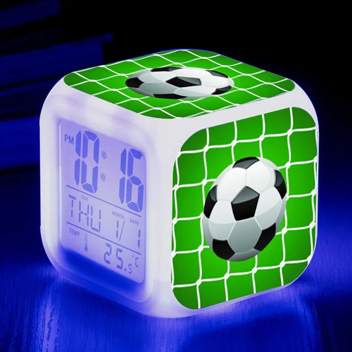 Colourful cartoon football pattern children's mute alarm clock on a table.