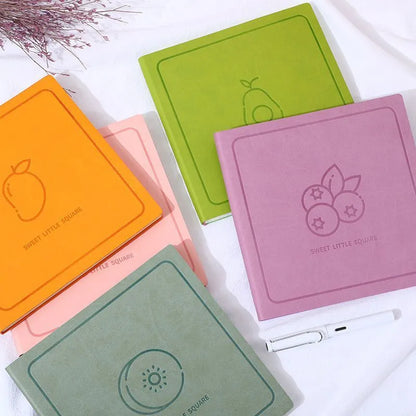 Square faux leather mesh cover notebook open on a blank Daolin paper page.