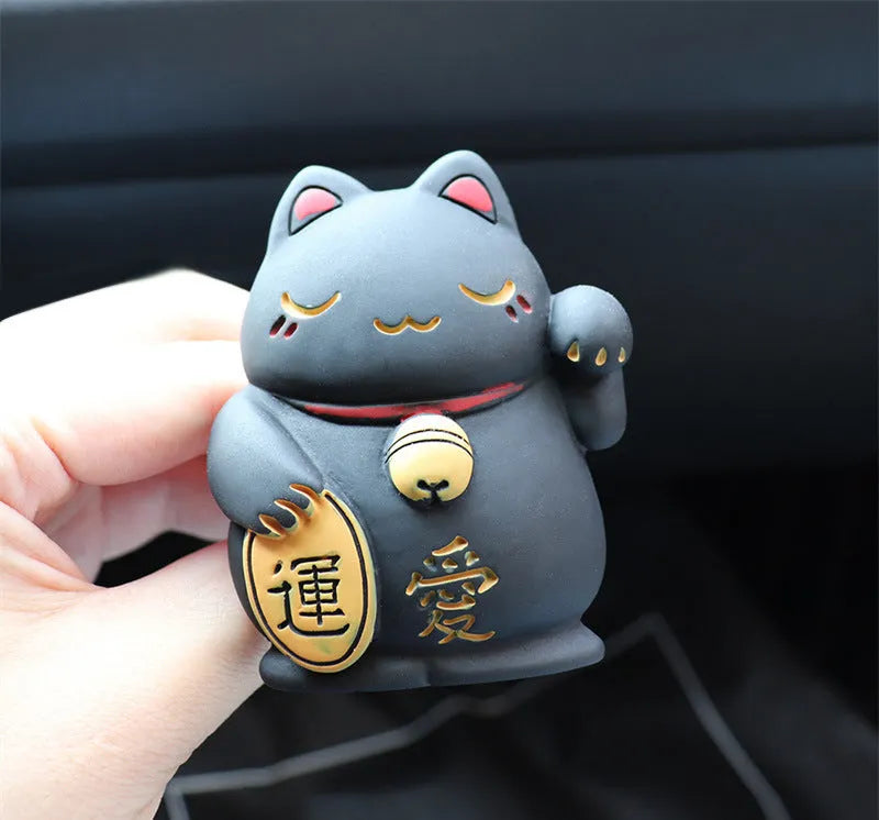 Resin cat-shaped car vent clip holding aromatherapy cotton for vehicle odour control