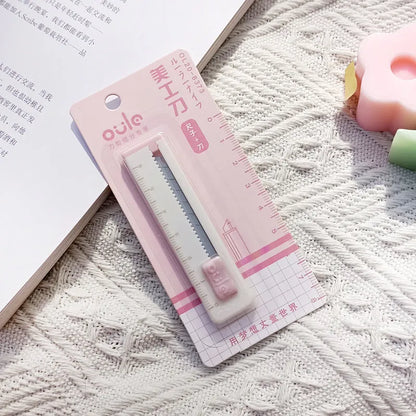 Small plastic blade art knife in five colours measuring 7.2cm long