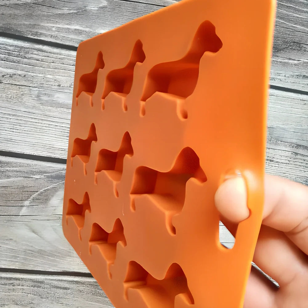 Orange silicone ice mould with 12 animal-shaped compartments for making decorative ice cubes