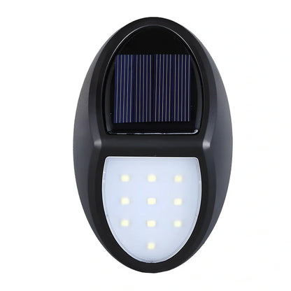 Black LED solar wall light with solar panel and 2835 lamp beads for outdoor illumination