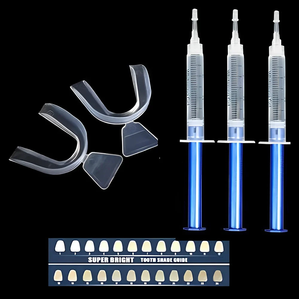 Teeth whitening gel kit with thermoform trays, cold light lamp, 10 gel syringes, and 3D shade guide showing 7-10 improvement