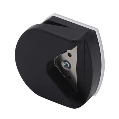 Black plastic and metal business card corner cutter on a white background