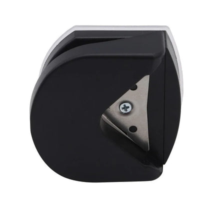 Black plastic and metal business card corner cutter on a white background