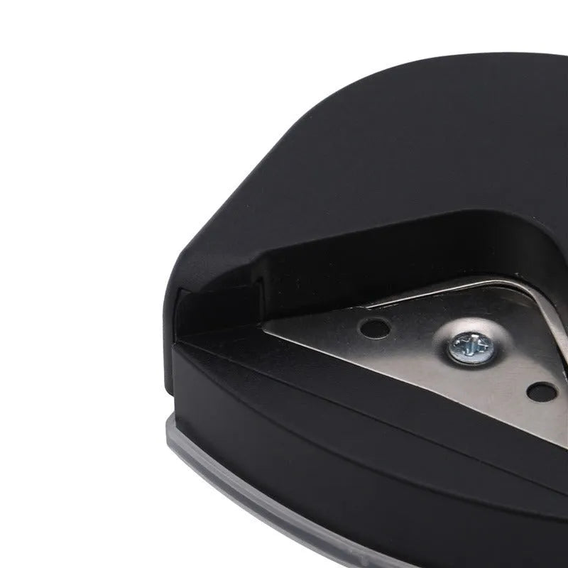 Black plastic and metal business card corner cutter on a white background