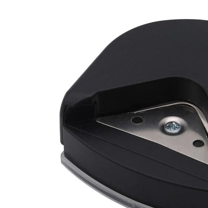 Black plastic and metal business card corner cutter on a white background