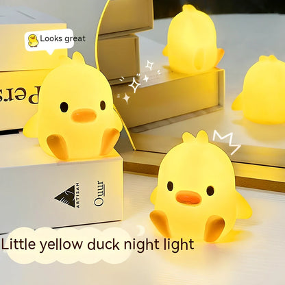 Small yellow duck-shaped night lamp measuring 6cm tall with warm LED light
