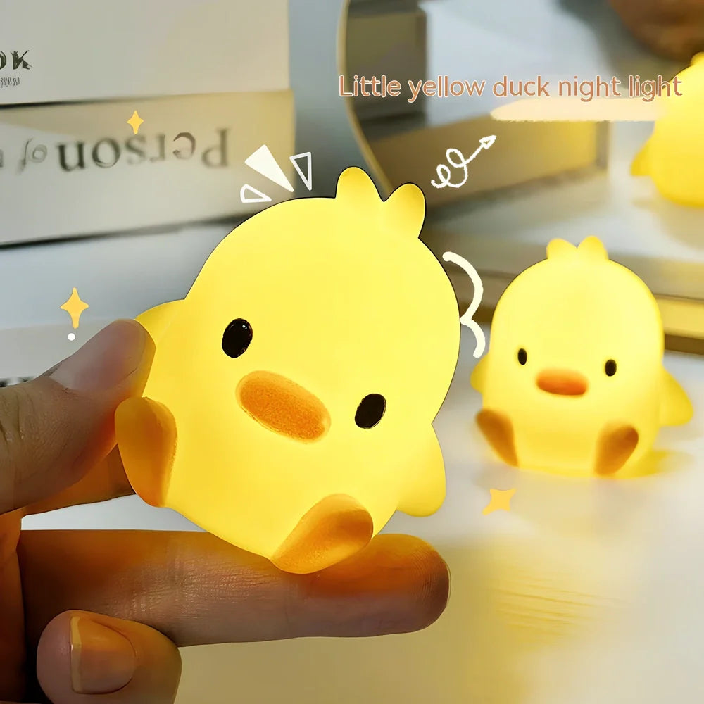 Small yellow duck-shaped night lamp measuring 6cm tall with warm LED light