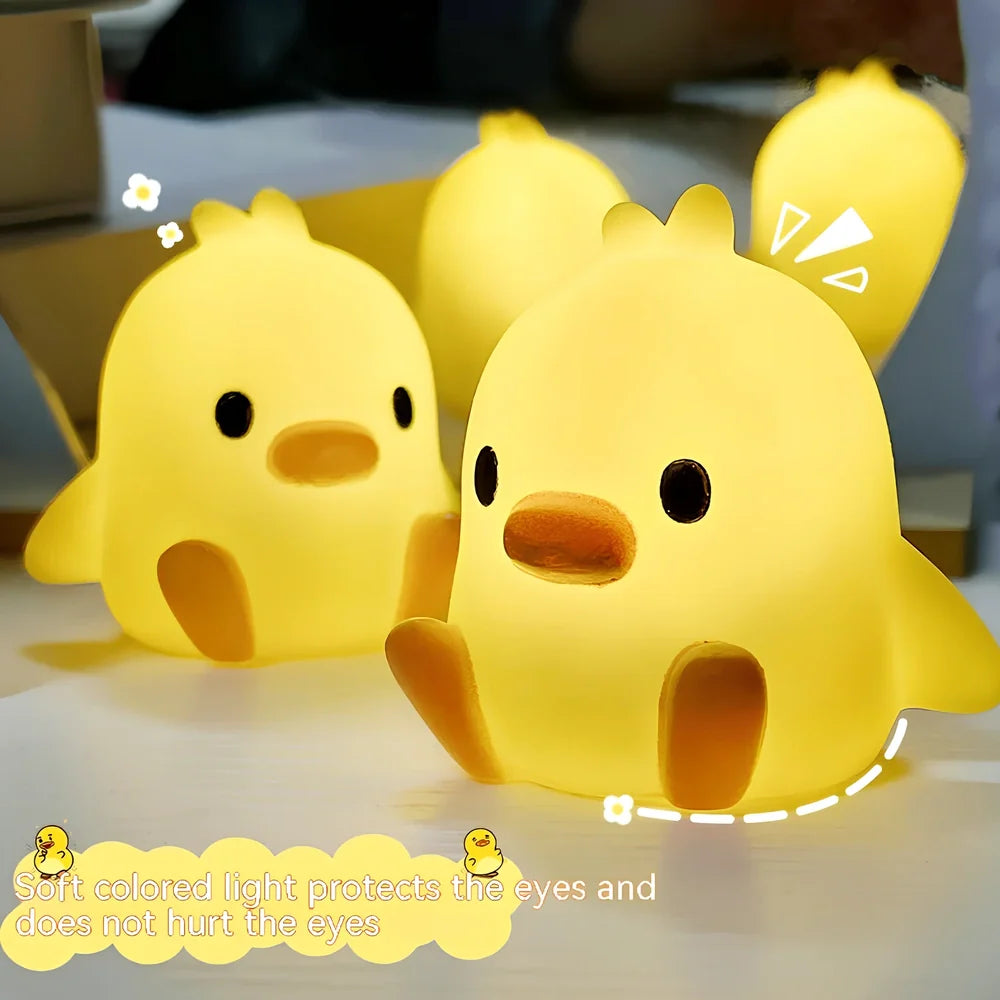 Small yellow duck-shaped night lamp measuring 6cm tall with warm LED light