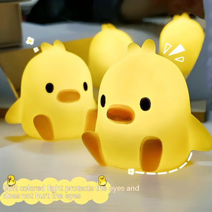Small yellow duck-shaped night lamp measuring 6cm tall with warm LED light