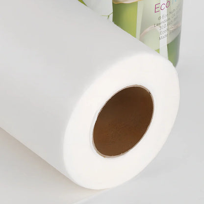 Roll of reusable bamboo paper towels showing thick fibre texture and sustainable packaging