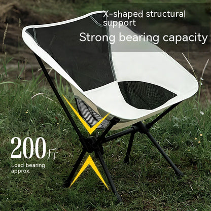 Outdoor folding chair with 600D Oxford cloth in ivory white, shown in folded position with storage bag