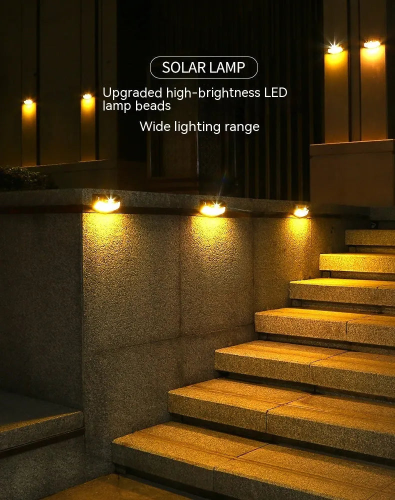 Solar outdoor wall lamp with smiling face design measuring 153mm × 76mm × 38mm for garden lighting