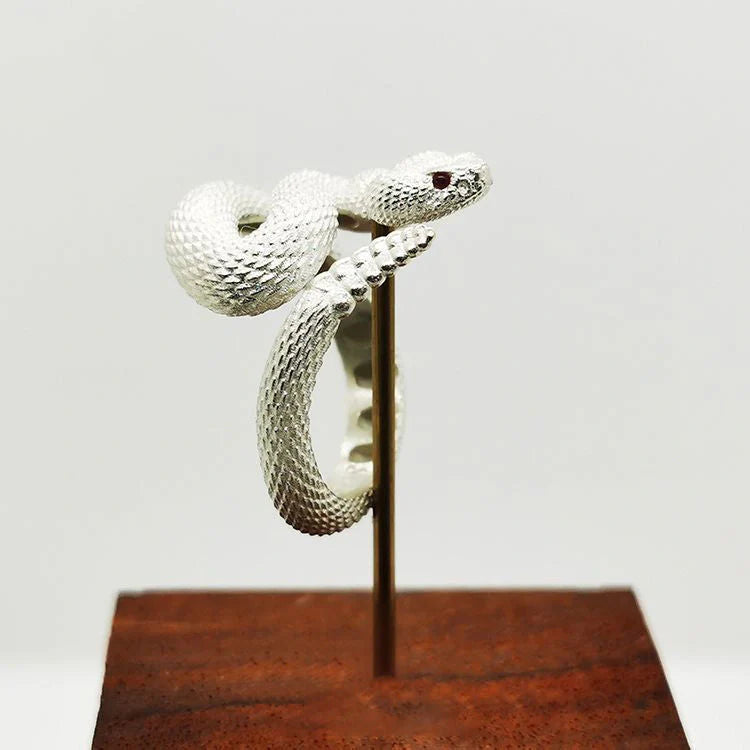 Adjustable snake ring with unique rattlesnake design in various color options, including white and black with open or shut mouth styles, and gold accents