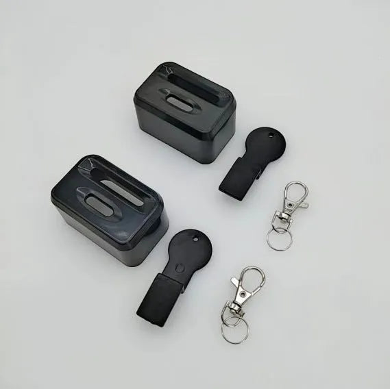 Black plastic seat belt lock clamp device shown on a car seat buckle.