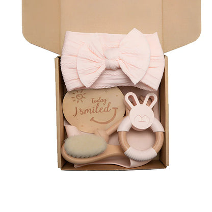 Six wooden animal bath toys floating in water with blue, brown and peach colour options