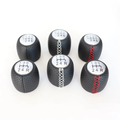 Alpha vehicle shift handball with wrapped perforated leather in black, red, or white line colours