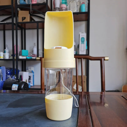 Portable 2-in-1 pet water bottle and feeder in various colors with lanyard for outdoor adventures