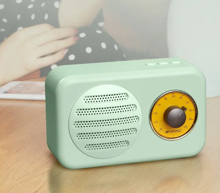 Portable Bluetooth wireless speaker with FM radio in wood grain finish