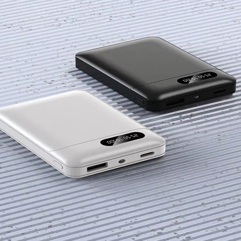 White or black large capacity portable power bank showing dimensions and USB output port.