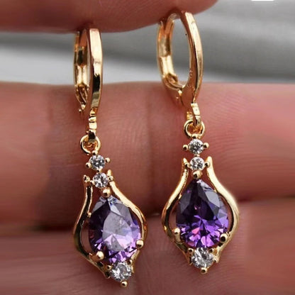 Elegant drop-shaped earrings with shimmering zircon accents in various colors, including purple, white, red, pink, and champagne