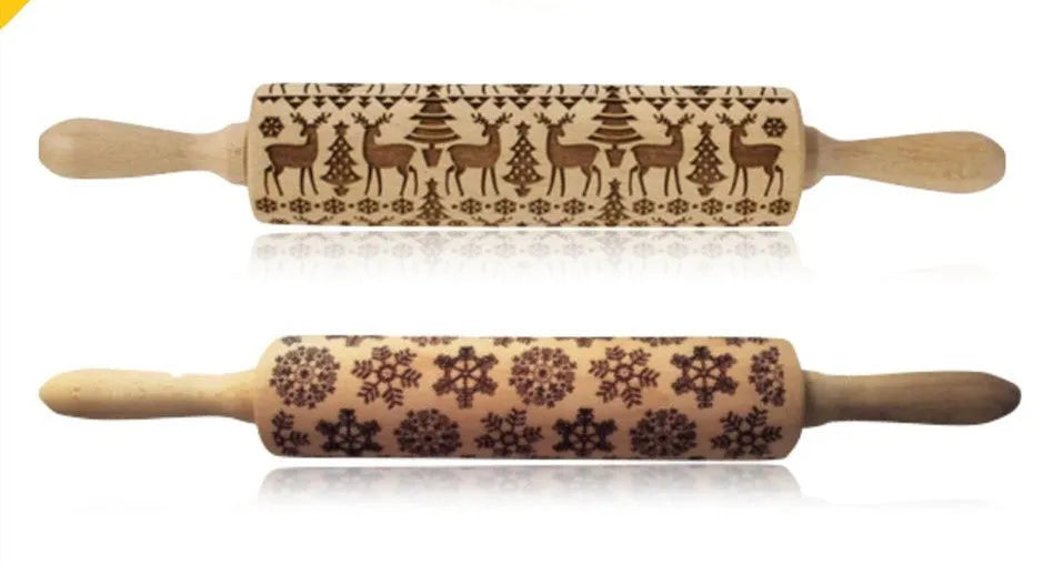 Wooden rolling pin with engraved Christmas patterns including reindeer and snowflakes on a 45cm long barrel.