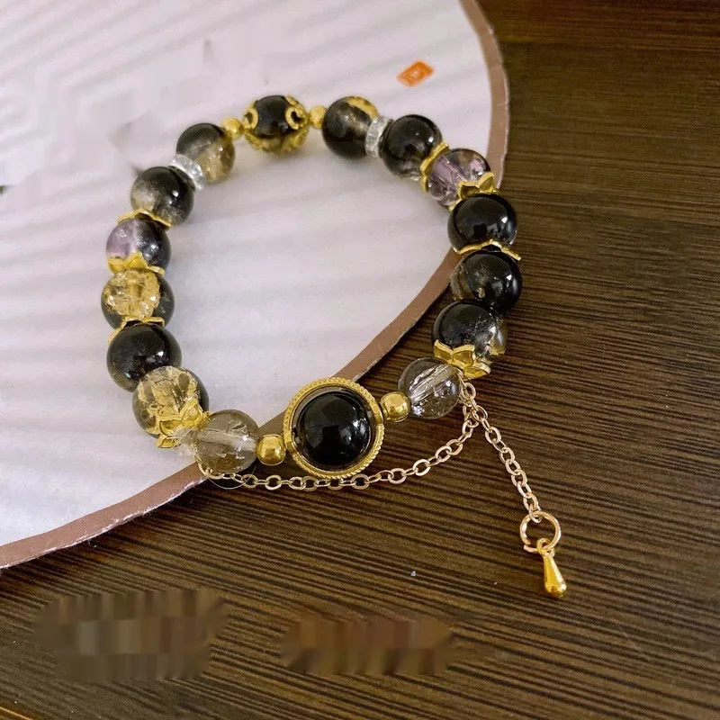Chinese style glass bead bracelet with bamboo joint design on wrist.