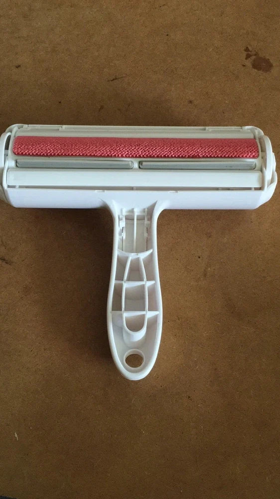 Blue pet hair removal comb with ABS plastic body and roller bristles for furniture cleaning