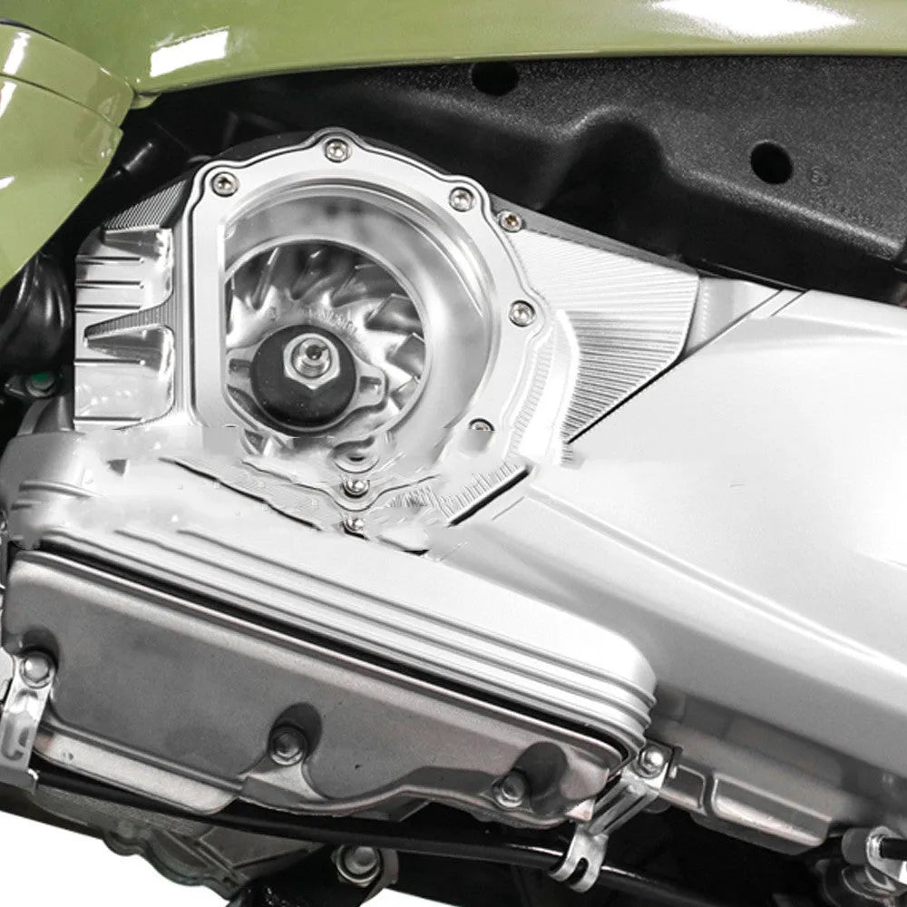 Vespa Primavera clutch intake cover in metallic finish shown on a scooter engine.