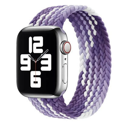 Apple Watch with elastic braided nylon strap in single-loop design showing stretch capability