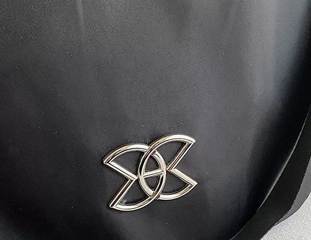 Trendy women's travel backpack in black and brown, featuring large capacity and waterproof material