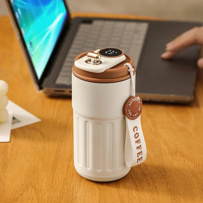 Portable digital stainless steel thermal bottle with temperature display, insulated for hot and cold drinks, designed for on-the-go use