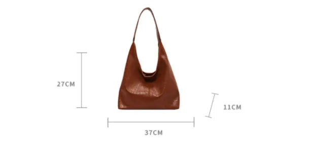 Casual soft leather large capacity shoulder bag in black with sandwich pocket and sewing thread details