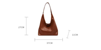 Casual soft leather large capacity shoulder bag in black with sandwich pocket and sewing thread details