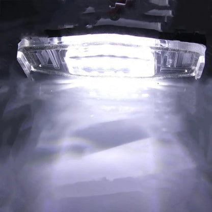Honda Civic LED licence plate light showing white 6500-7000K illumination with plastic housing