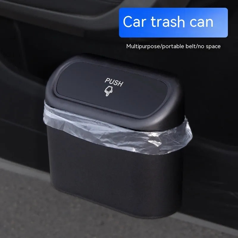 Black plastic folding car trash can mounted on vehicle seat back