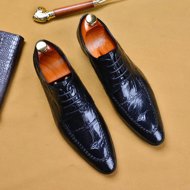 Men's black alligator pattern leather shoes with a horse bit buckle and rubber sole.