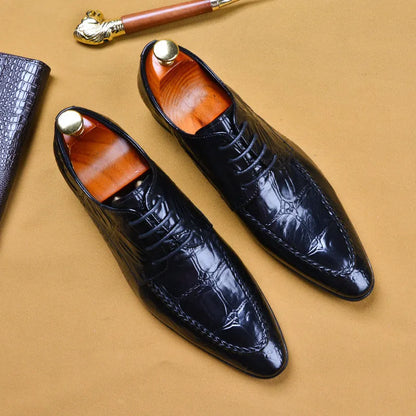 Men's black alligator pattern leather shoes with a horse bit buckle and rubber sole.