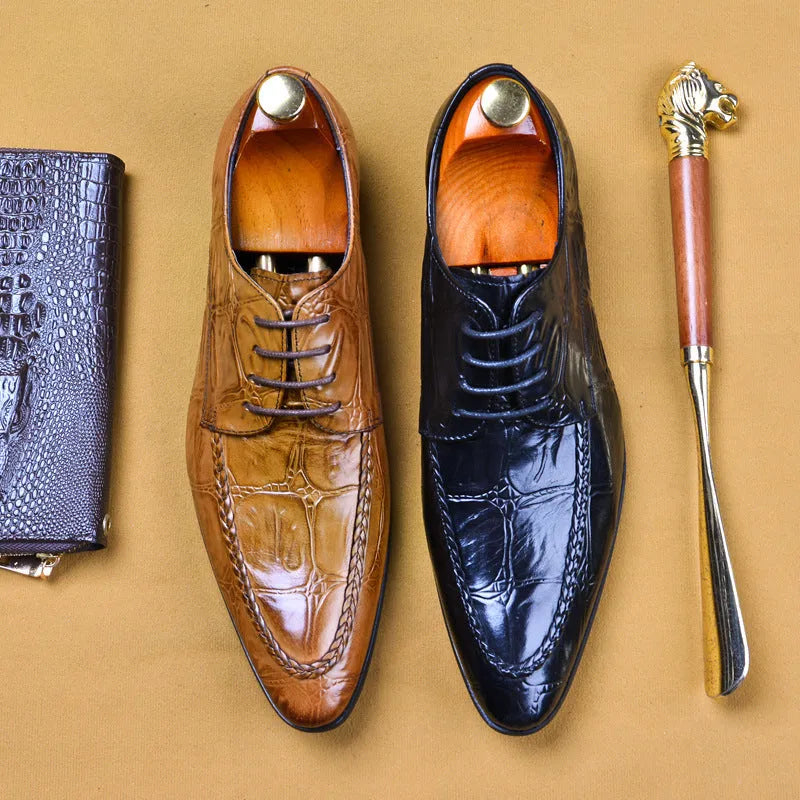 Men's black alligator pattern leather shoes with a horse bit buckle and rubber sole.