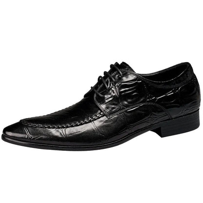 Men's black alligator pattern leather shoes with a horse bit buckle and rubber sole.
