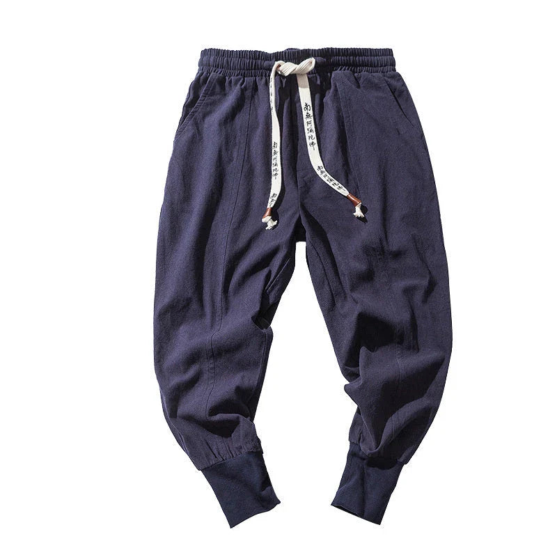 Comfortable linen and cotton harem pants for men, available in black, navy blue, and red colors, with relaxed fit and elastic waistband for all-day comfort.