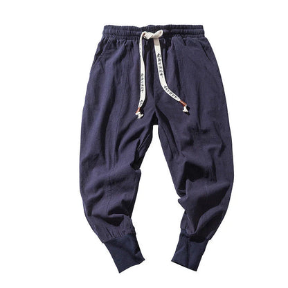 Comfortable linen and cotton harem pants for men, available in black, navy blue, and red colors, with relaxed fit and elastic waistband for all-day comfort.