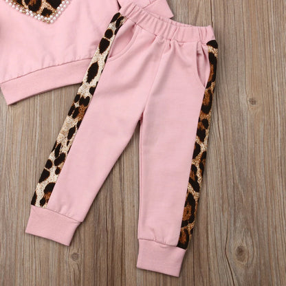 Pink cotton print sweatshirt and matching pants two-piece set with Asian sizing chart showing measurements
