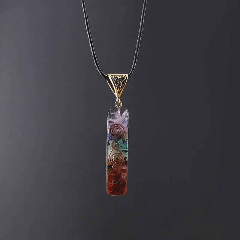 A stylish 7-chakra crystal pendant featuring a unique geometric design and natural stone patterns