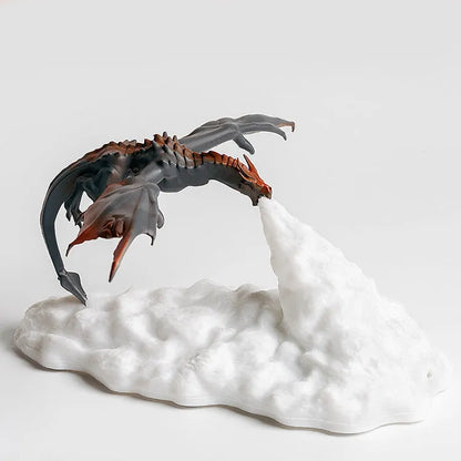 3D printed fire-breathing dragon night light with warm red LED illumination on dark surface