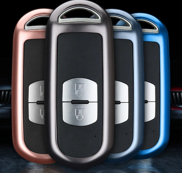 Aluminum alloy key case for Mazda with CNC engraving, available in sapphire, blue, grey, and rose gold