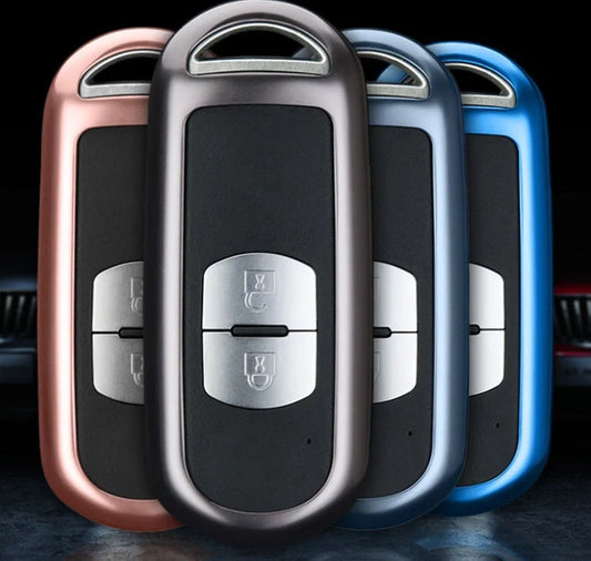 Aluminum alloy key case for Mazda with CNC engraving, available in sapphire, blue, grey, and rose gold